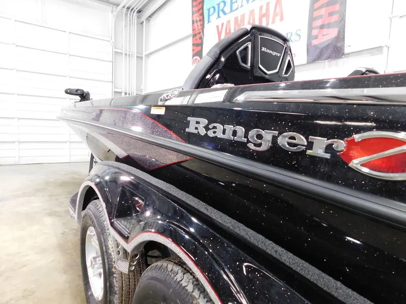 Slide: The Image of 2024 Ranger Z521R boat in a showroom. - 6