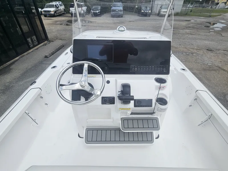 Slide: The Image of Interior view of 2026 Tidewater 2110BMT boat with steering console. - 10