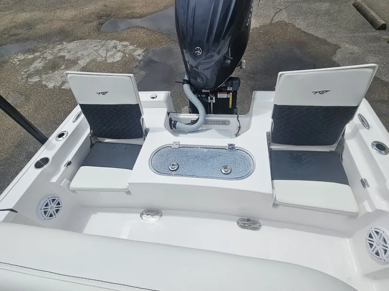 Slide: The Image of Interior view of 2026 Tidewater 2110BMT boat with seating and motor. - 7