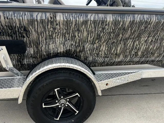 Slide: The Image of 2026 Thor LH1900CC boat with Mossy Oak camouflage and trailer. - 15