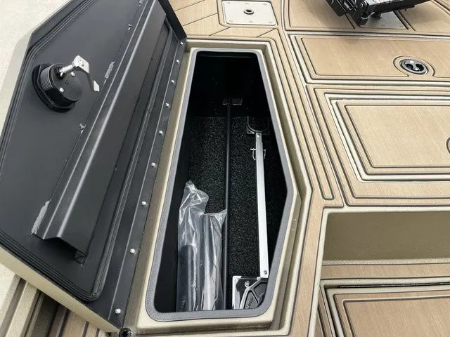 Slide: The Image of 2026 Thor LH1900CC boat with open storage compartment lid. - 20