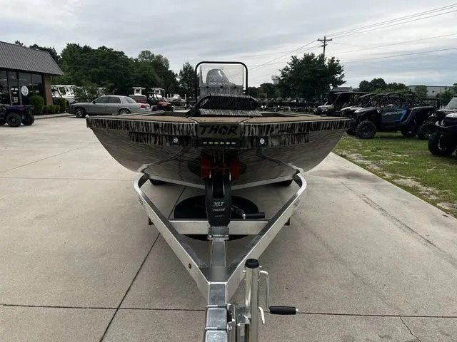 Slide: The Image of 2026 Thor LH1900CC boat on trailer, Mossy Oak design. - 3
