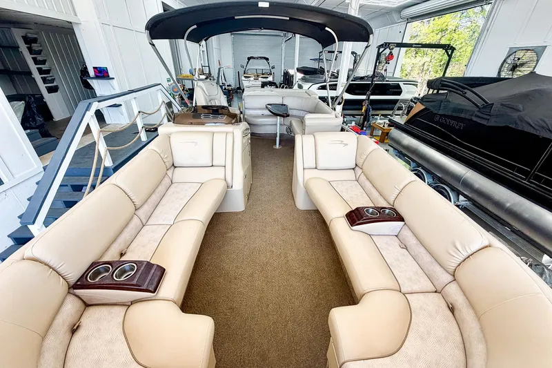 Slide: The Image of Luxurious interior of a 2011 Bennington 2275RLi pontoon boat with plush seating. - 4