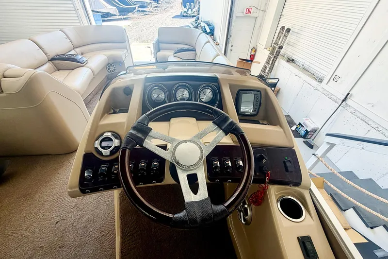 Slide: The Image of Steering console of a 2011 Bennington 2275RLi pontoon boat with gauges and controls. - 6