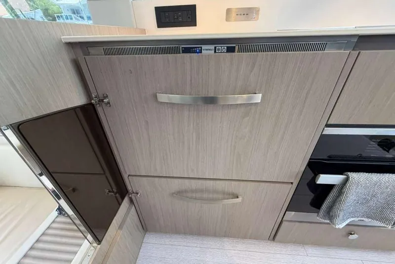 Slide: The Image of Modern kitchen cabinetry in 2022 Azimut Fly 50 yacht interior. - 10