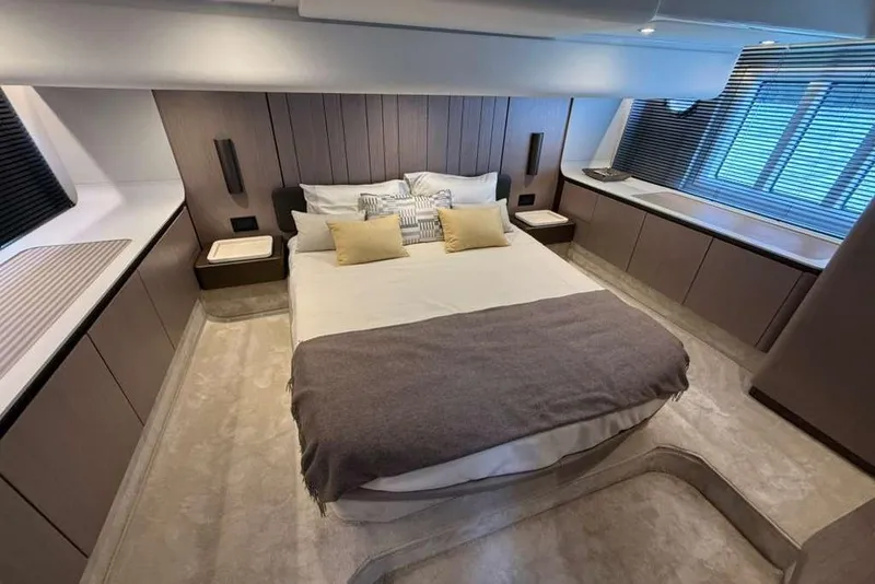 Slide: The Image of Luxurious bedroom interior of 2022 Azimut Fly 50 yacht, featuring modern design and elegant furnishings. - 13
