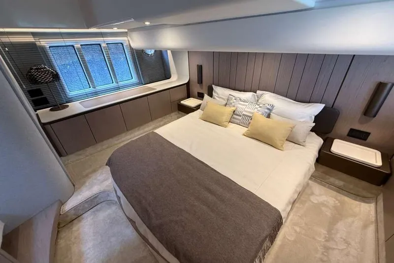 Slide: The Image of Luxurious bedroom interior of 2022 Azimut Fly 50 yacht with modern design and cozy bedding. - 14