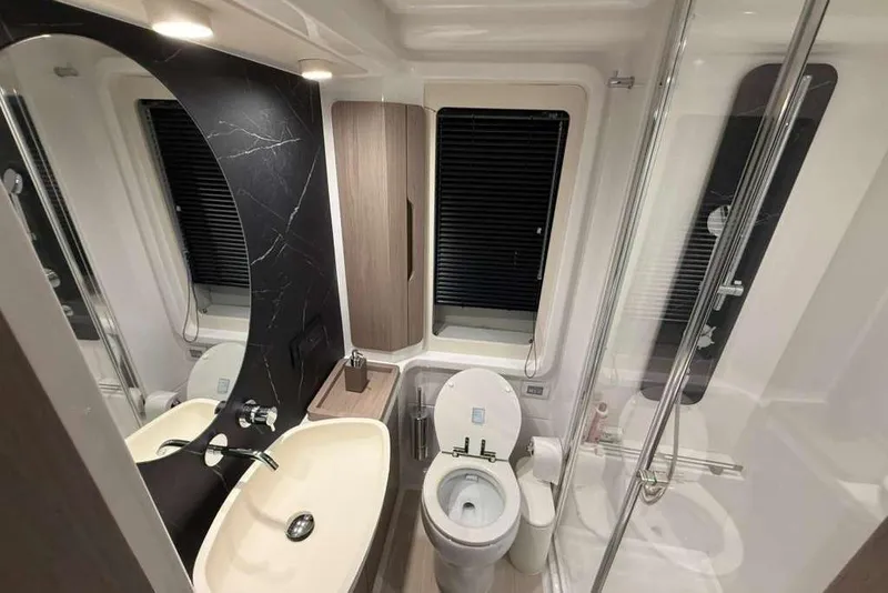 Slide: The Image of Luxurious bathroom in 2022 Azimut Fly 50 yacht with modern fixtures and elegant design. - 16