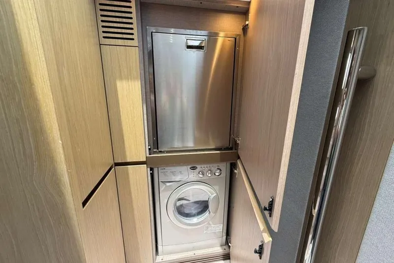 Slide: The Image of Laundry area in 2022 Azimut Fly 50 yacht with washer and dryer. - 17