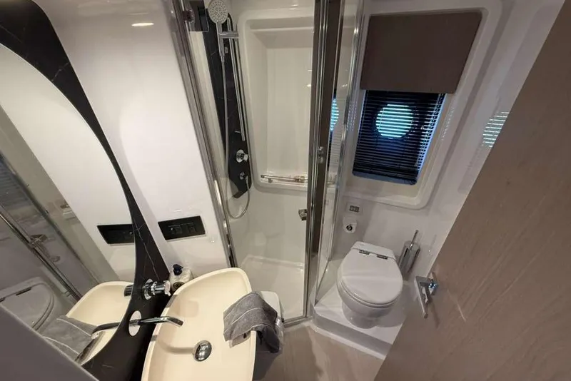 Slide: The Image of Luxurious bathroom in 2022 Azimut Fly 50 yacht, featuring modern fixtures and elegant design. - 18