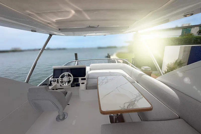 Slide: The Image of Luxurious 2022 Azimut Fly 50 yacht interior with elegant seating and steering console. - 23