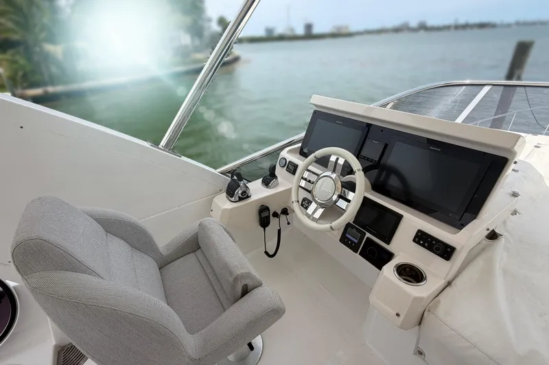 Slide: The Image of Cockpit of 2022 Azimut Fly 50 yacht with modern controls and comfortable seating. - 24