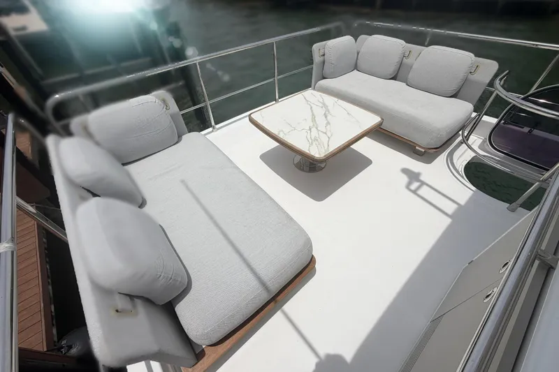 Slide: The Image of Luxurious seating area on 2022 Azimut Fly 50 yacht with elegant marble table. - 26
