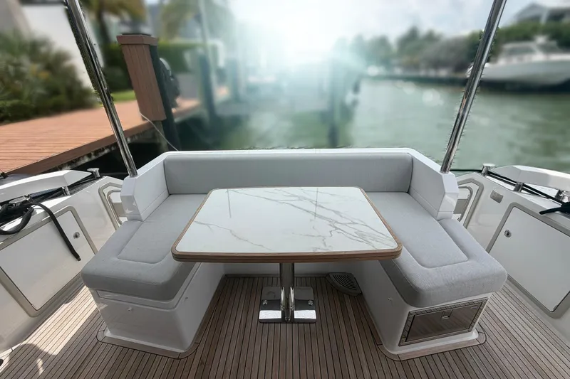 Slide: The Image of Luxurious seating area on 2022 Azimut Fly 50 yacht with marble table and waterfront view. - 3