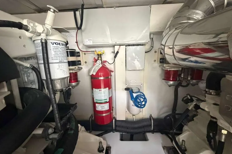 Slide: The Image of Engine room of 2022 Azimut Fly 50 yacht with fire extinguisher and Volvo components. - 32