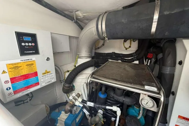 Slide: The Image of Engine room of 2022 Azimut Fly 50 yacht, featuring Dometic equipment and complex piping system. - 35