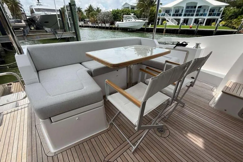 Slide: The Image of Outdoor seating area on 2022 Azimut Fly 50 yacht with wooden deck and modern furniture. - 4