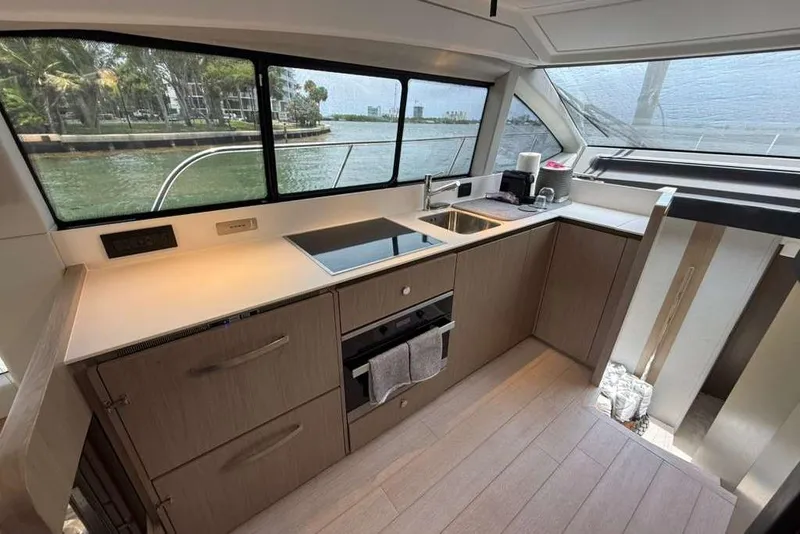 Slide: The Image of Modern kitchen interior of 2022 Azimut Fly 50 yacht with sleek design and waterfront view. - 9