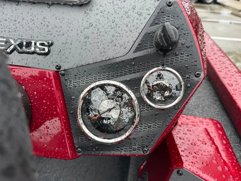 Slide: The Image of Close-up of a 2025 Vexus AVX1880 boat dashboard with raindrops. - 14