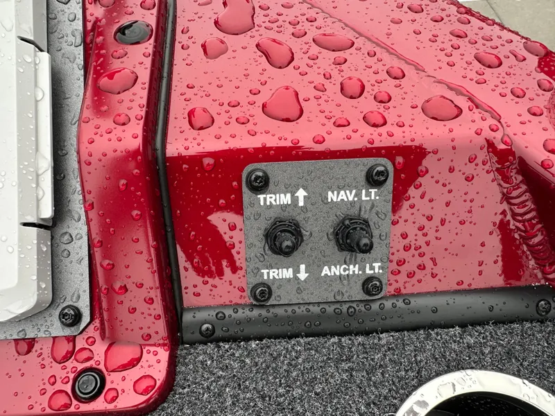 Slide: The Image of Vexus AVX1880 2025 boat controls with water droplets on red surface. - 22