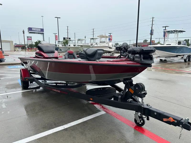 Slide: The Image of 2025 Vexus AVX1880 boat parked on trailer outdoors. - 6