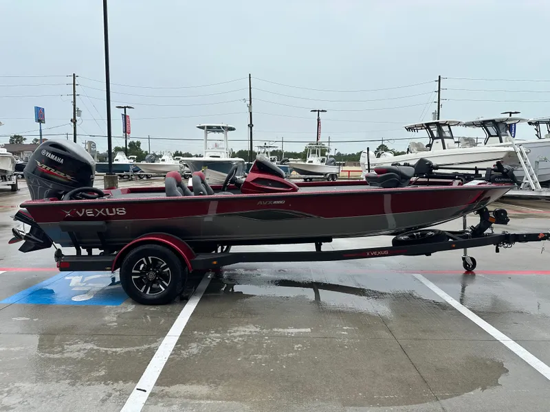 Slide: The Image of 2025 Vexus AVX1880 boat parked on a trailer outdoors. - 7