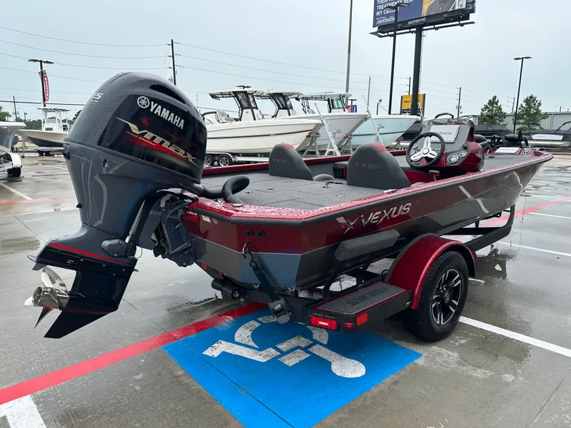 Slide: The Image of Vexus AVX1880 2025 boat with Yamaha engine in parking lot. - 8