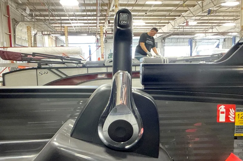 Slide: The Image of 2026 Bennington 22 M Open Fastback Quad Bench in a factory setting. - 15