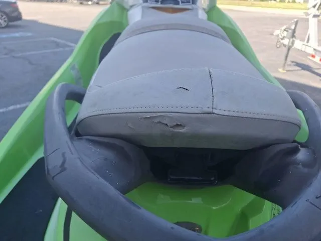 Slide: The Image of Close-up of a 2014 Sea-Doo GTI jet ski with a damaged seat. - 3