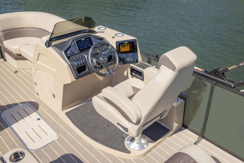Slide: The Image of Manufacturer Provided Image: 2026 Bentley Pontoons Elite 223 Swingback interior with helm and seating on water. - 5