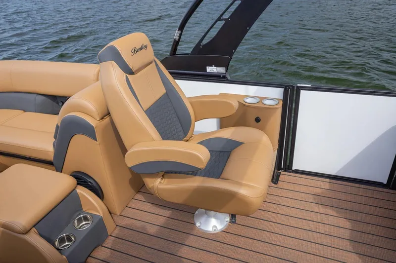 Slide: The Image of Manufacturer Provided Image: 2026 Bentley Pontoons Elite 223 Swingback with luxurious tan seating on a pontoon boat. - 7