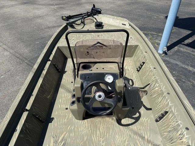Slide: The Image of 2022 Tracker 1860CC Jon MXW Grizzly boat cockpit view. - 4