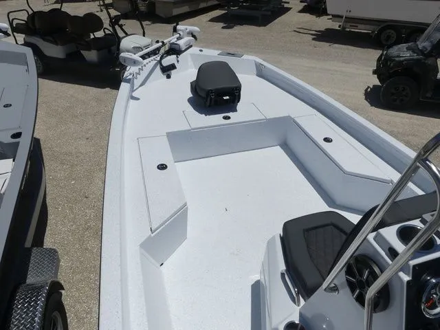 Slide: The Image of 2026 Xpress Boats SW22B with spacious deck and helm console. - 10