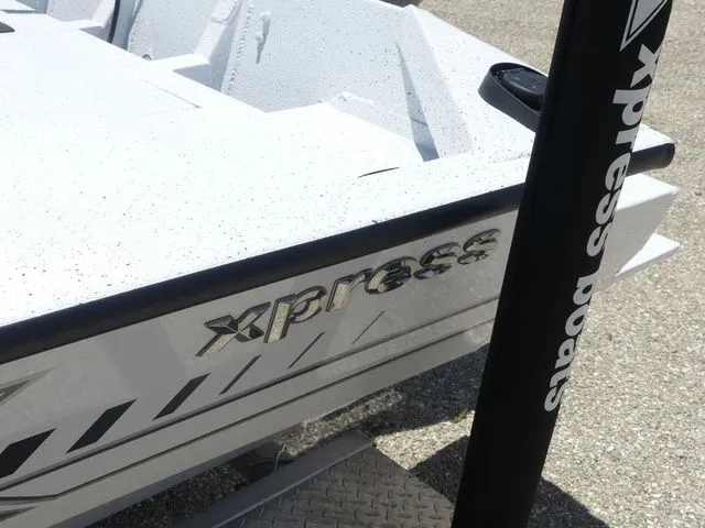 Slide: The Image of 2026 Xpress Boats SW22B, white boat with logo. - 7