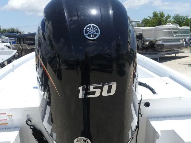 Slide: The Image of Outboard motor of a 2026 Xpress Boats SW22B. - 9
