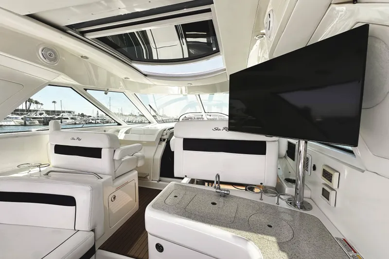Slide: The Image of Luxurious interior of 2010 Sea Ray 450 Sundancer yacht with modern amenities and sleek design. - 19
