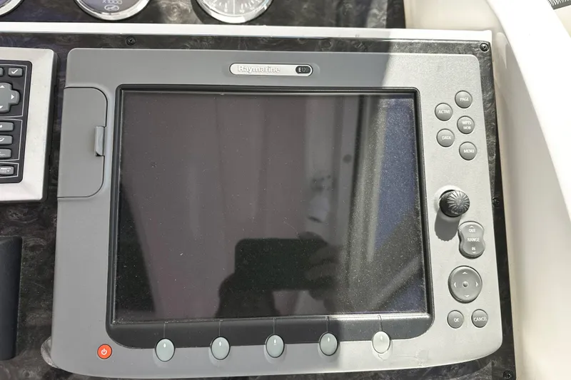 Slide: The Image of Raymarine E120 navigation display on 2010 Sea Ray 450 Sundancer yacht dashboard. - 28