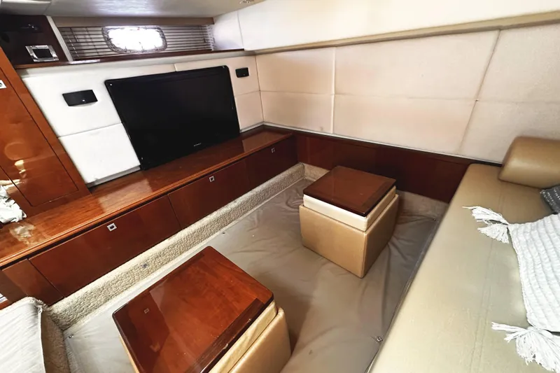 Slide: The Image of Luxurious interior of 2010 Sea Ray 450 Sundancer yacht with TV and seating area. - 36