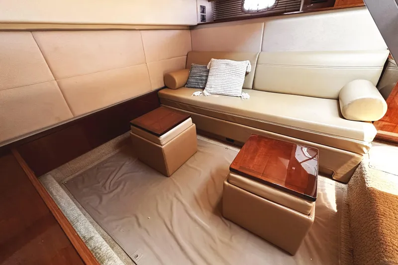 Slide: The Image of Luxurious interior of 2010 Sea Ray 450 Sundancer yacht with beige seating and wooden accents. - 37