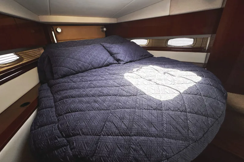 Slide: The Image of Luxurious cabin interior of 2010 Sea Ray 450 Sundancer yacht with cozy bedding. - 41