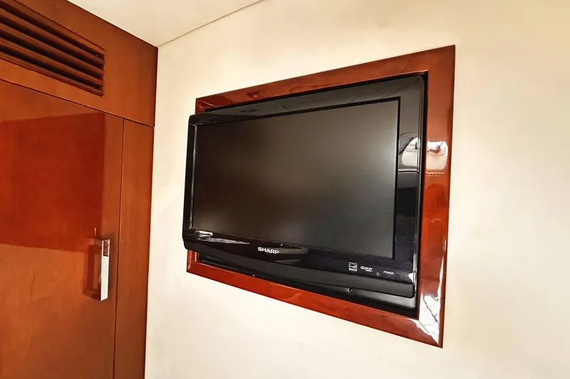 Slide: The Image of Flat-screen TV mounted on a 2010 Sea Ray 450 Sundancer yacht interior. - 44