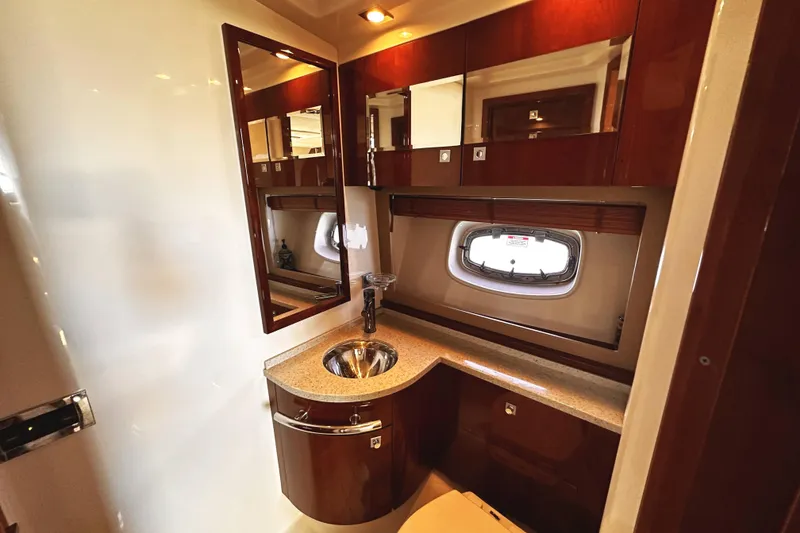 Slide: The Image of Luxurious bathroom interior of 2010 Sea Ray 450 Sundancer yacht with wood cabinetry. - 46