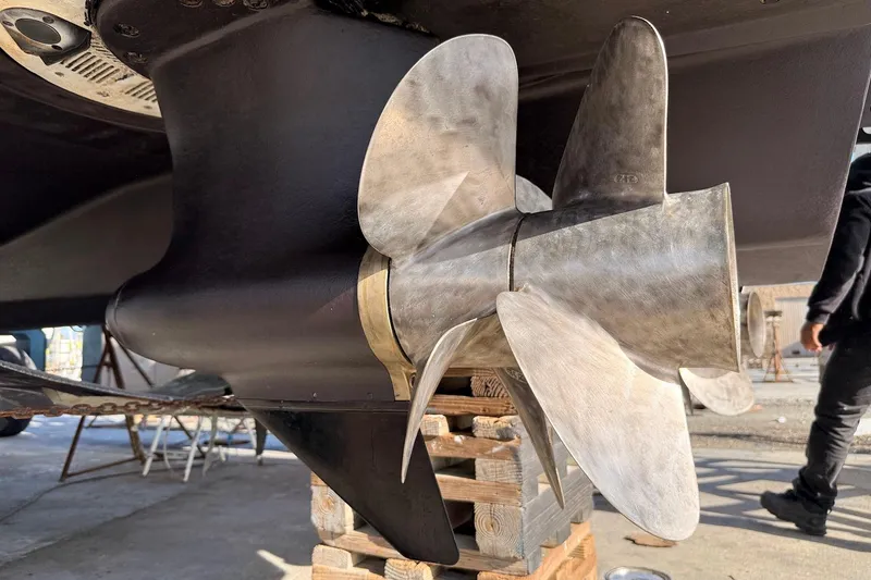Slide: The Image of Propeller of a 2010 Sea Ray 450 Sundancer yacht on wooden blocks. - 58