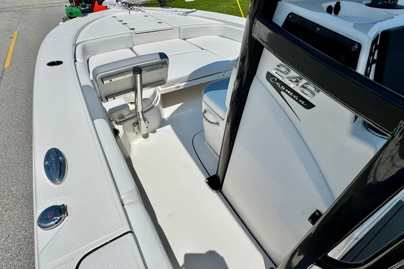Slide: The Image of 2021 Robalo 246 Cayman boat interior with seating and console details. - 12