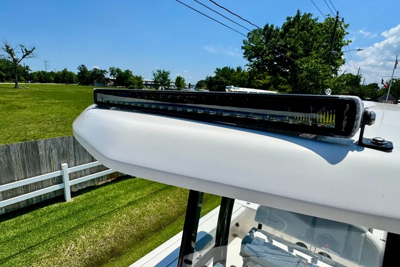 Slide: The Image of 2021 Robalo 246 Cayman boat with mounted LED light bar on top. - 18
