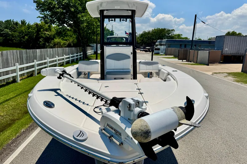 Slide: The Image of 2021 Robalo 246 Cayman boat with trolling motor on a sunny day. - 6