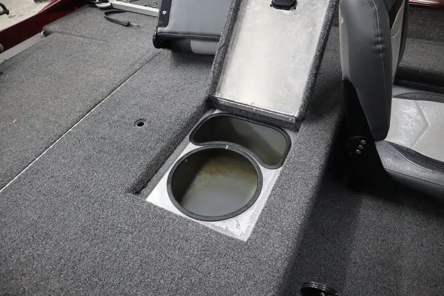 Slide: The Image of Interior of Lowe Skorpion 17 boat, 2022 model, featuring open storage compartment. - 17