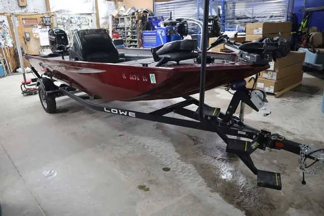 Slide: The Image of 2022 Lowe Skorpion 17 boat in a workshop. - 3
