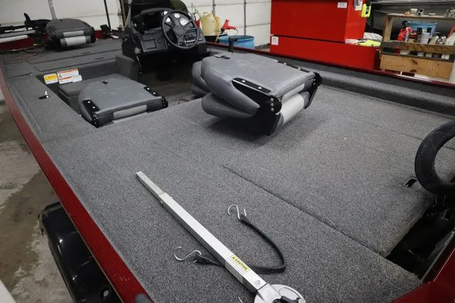 Slide: The Image of Interior view of a 2022 Lowe Skorpion 17 boat in a garage. - 7