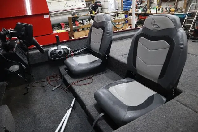 Slide: The Image of Interior of Lowe Skorpion 17 boat, 2022 model, featuring gray seats. - 8